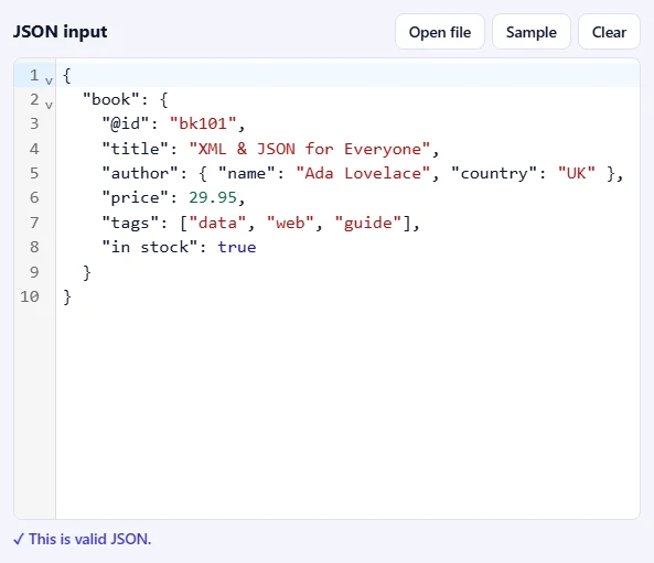 The JSON input box filled with sample JSON, with Open file, Sample and Clear buttons, and the message “This is valid JSON” below it.