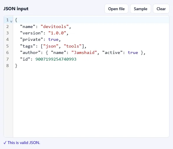 The JSON input box filled with sample JSON, with Open file, Sample and Clear buttons, and the message “This is valid JSON” below it.